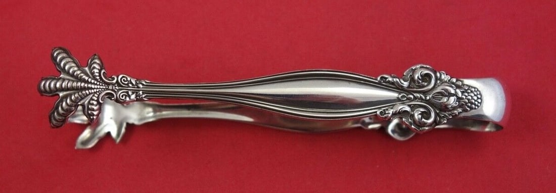 International Sterling Silver Sugar Tong Jeanne d' Arc 4 3/4 Inch: International Sterling Silver Sugar Tong Jeanne d' Arc 4 3/4 Inch This exquisite sugar tong by International Silver features the elegant Jeanne d' Arc pattern. Crafted from high-quality sterling silve