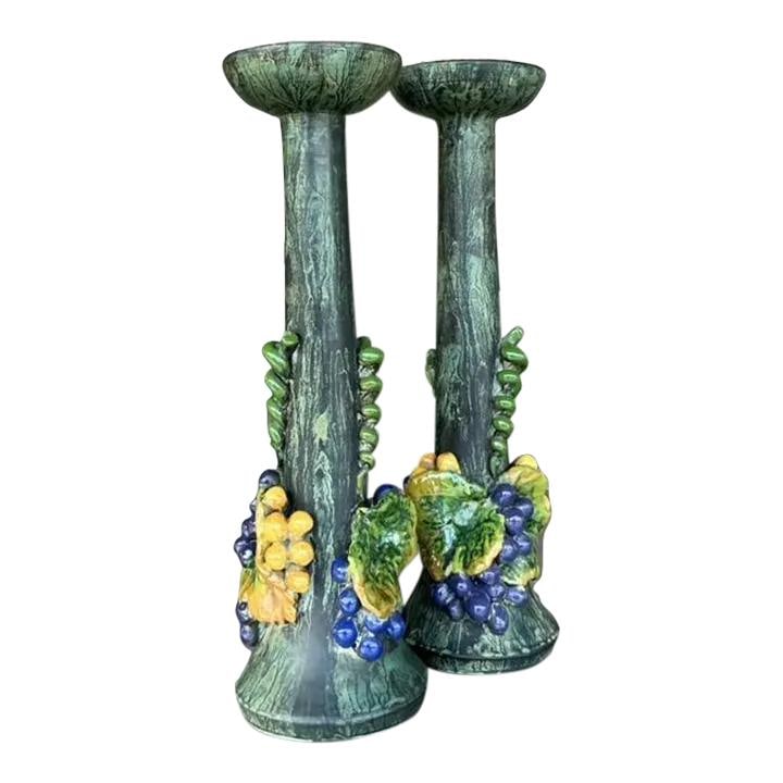 Pair of Vintage Boho Ceramic Grapes Candlesticks in Jade: Pair of Vintage Boho Ceramic Grapes Candlesticks in Jade Enhance your home decor with these Vintage Boho Glazed Ceramic Grapes Candlesticks. Featuring intricate grape designs and a beautiful jade glaz