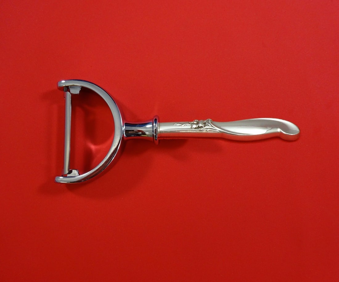 International Sterling Silver Melody Custom Vegetable Peeler 6 inch: International Sterling Silver Melody Custom Vegetable Peeler 6 inch Introducing the Silver Melody Vegetable Peeler by International Sterling, a beautifully crafted kitchen tool designed for both funct