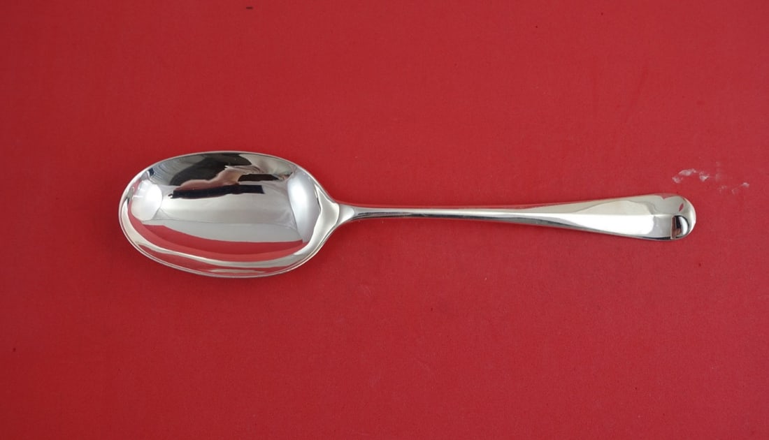 Sterling Silver Rattail Serving Spoon by CJ Vander 8.25 Inch: Sterling Silver Rattail Serving Spoon by CJ Vander 8.25 Inch This is a Rattail pattern serving spoon by CJ Vander, crafted from English sterling silver. The spoon measures 8 1/4 inches in length and i