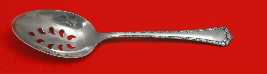 Easterling Rosemary Sterling Silver 9-Hole Pierced Serving Spoon Custom Made: Easterling Rosemary Sterling Silver 9-Hole Pierced Serving Spoon Custom Made This exquisite serving spoon from the Rosemary pattern by Easterling is crafted from high-quality sterling silver. The slot