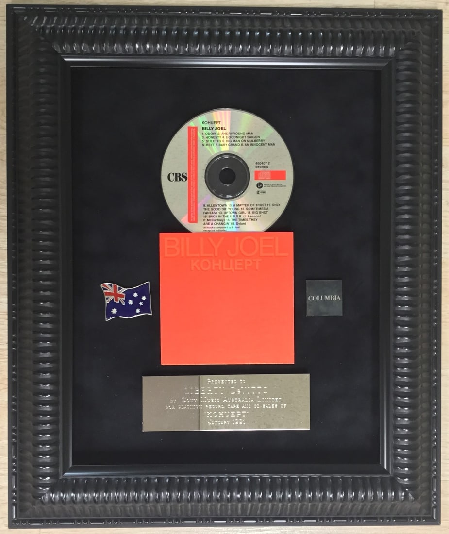 Billy Joel Liberty Devitto Limited Award CD Framed 18x15: Billy Joel Liberty Devitto Limited Award CD Framed 18x15 This limited award features a CD from Billy Joel, recognized for its significance in the rock and pop genre. The piece is custom framed in a sl