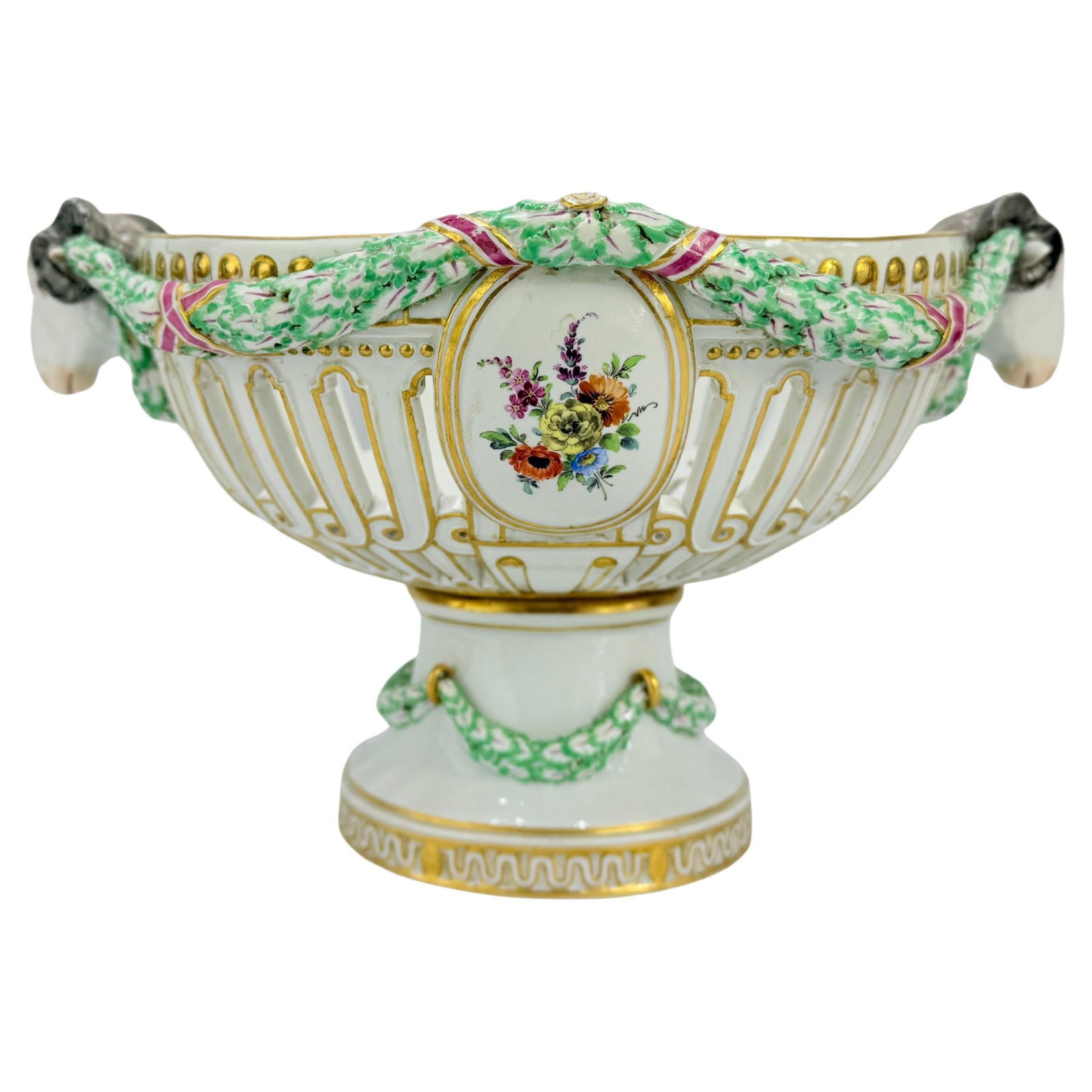 19th Century Meissen Porcelain Ram's Head Floral Centerpiece: 19th Century Meissen Porcelain Ram's Head Floral Centerpiece This exquisite 19th Century Meissen porcelain centerpiece showcases a stunning Neoclassical design. Crafted in Germany, it features an oval