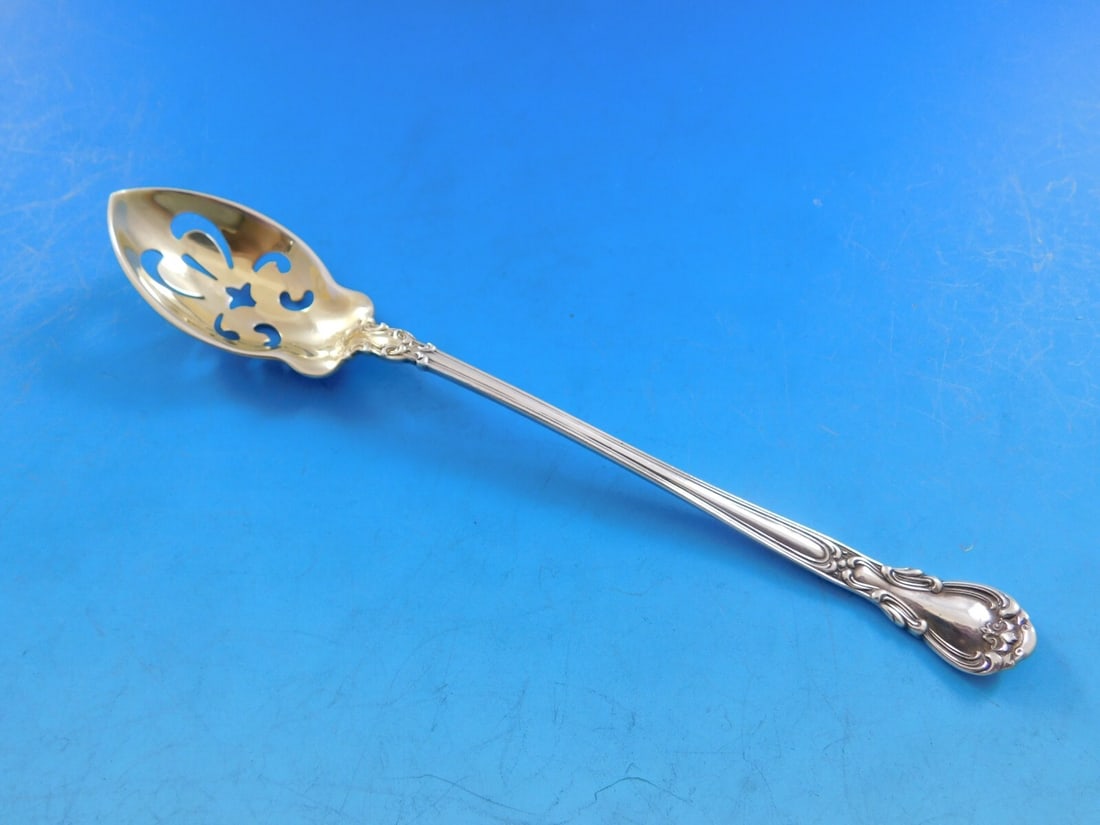Gorham Chantilly Sterling Silver Olive Spoon 5 7/8" Pierced Gold Washed: Gorham Chantilly Sterling Silver Olive Spoon 5 7/8" Pierced Gold Washed Discover the elegance of the Chantilly pattern by Gorham with this exquisite Sterling Silver Olive Spoon. Measuring 5 7/8 inches