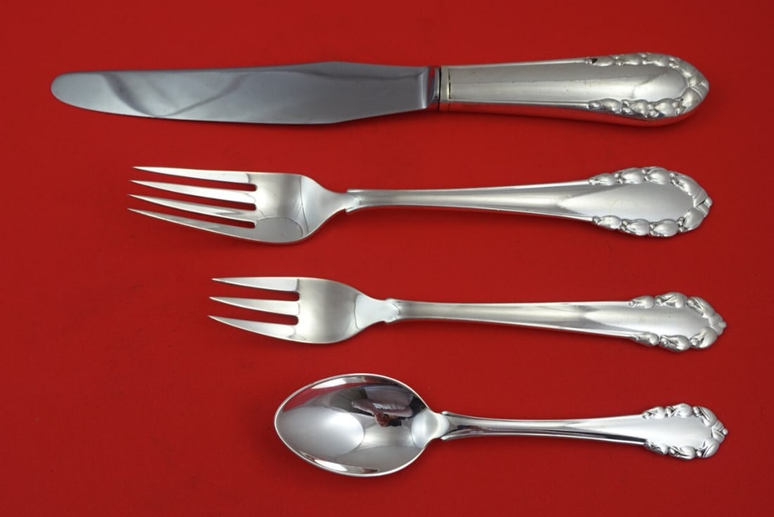 Georg Jensen Lily of the Valley Sterling Silver 4-Piece Place Setting: Georg Jensen Lily of the Valley Sterling Silver 4-Piece Place Setting Offering a beautiful 4-piece dinner size place setting in the iconic "Lily of the Valley" pattern by Georg Jensen, crafted from hi