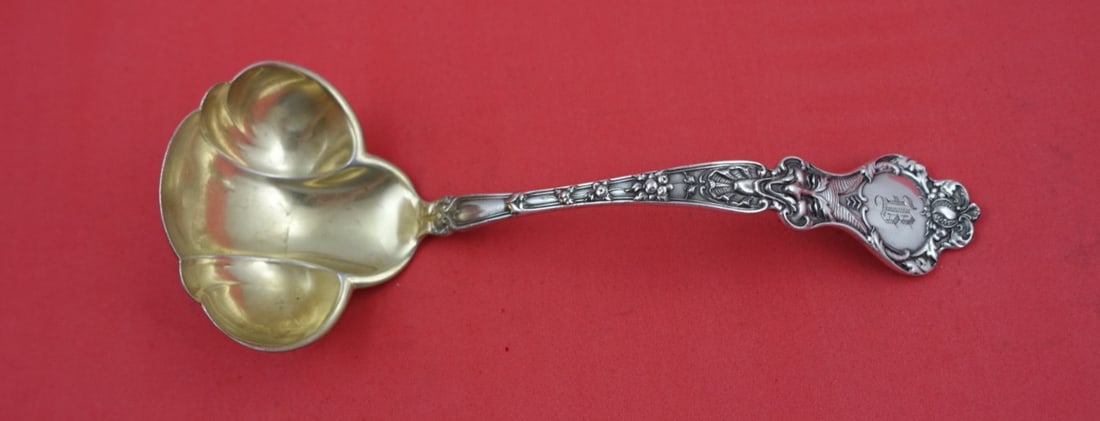 Alvin Nuremburg Sterling Silver Gravy Ladle Gold Wash 7 1/4": Alvin Nuremburg Sterling Silver Gravy Ladle Gold Wash 7 1/4" This elegant gravy ladle from the Nuremburg pattern by Alvin is crafted from high-quality sterling silver, showcasing a beautiful gold wash