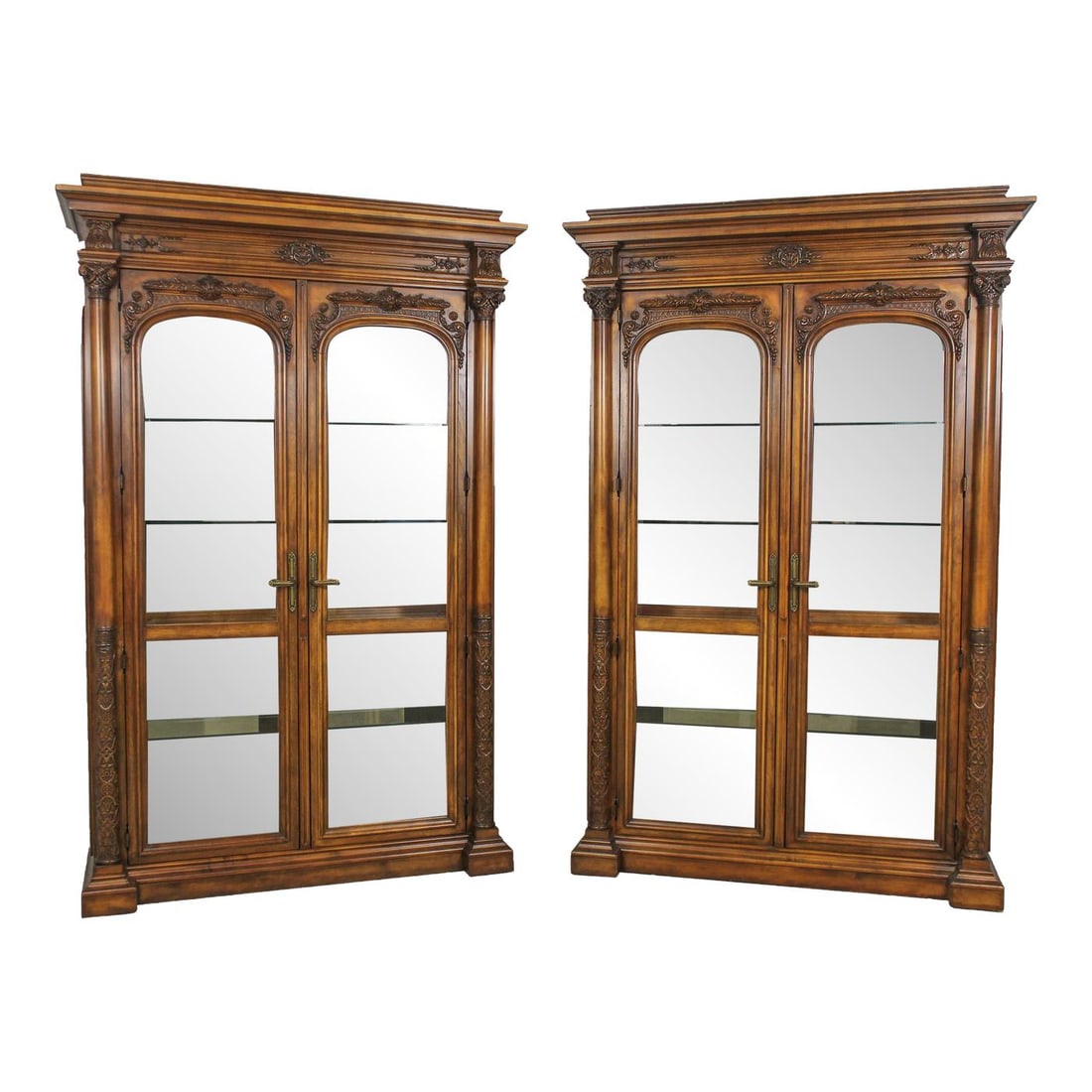 Henredon Monumental Beveled Glass Curio Cabinets Pair Renaissance Revival: Henredon Monumental Beveled Glass Curio Cabinets Pair Renaissance Revival This striking pair of monumental curio cabinets by Henredon showcases exquisite craftsmanship and attention to detail. Featuri