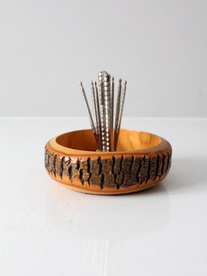 Mid Century Wooden Nut Cracker Bowl Set with HMQ Cracker and Picks: Mid Century Wooden Nut Cracker Bowl Set with HMQ Cracker and Picks This mid-century nutcracker bowl set offers a charming solution for enjoying walnuts, hazelnuts, and other shelled nuts. The rustic w