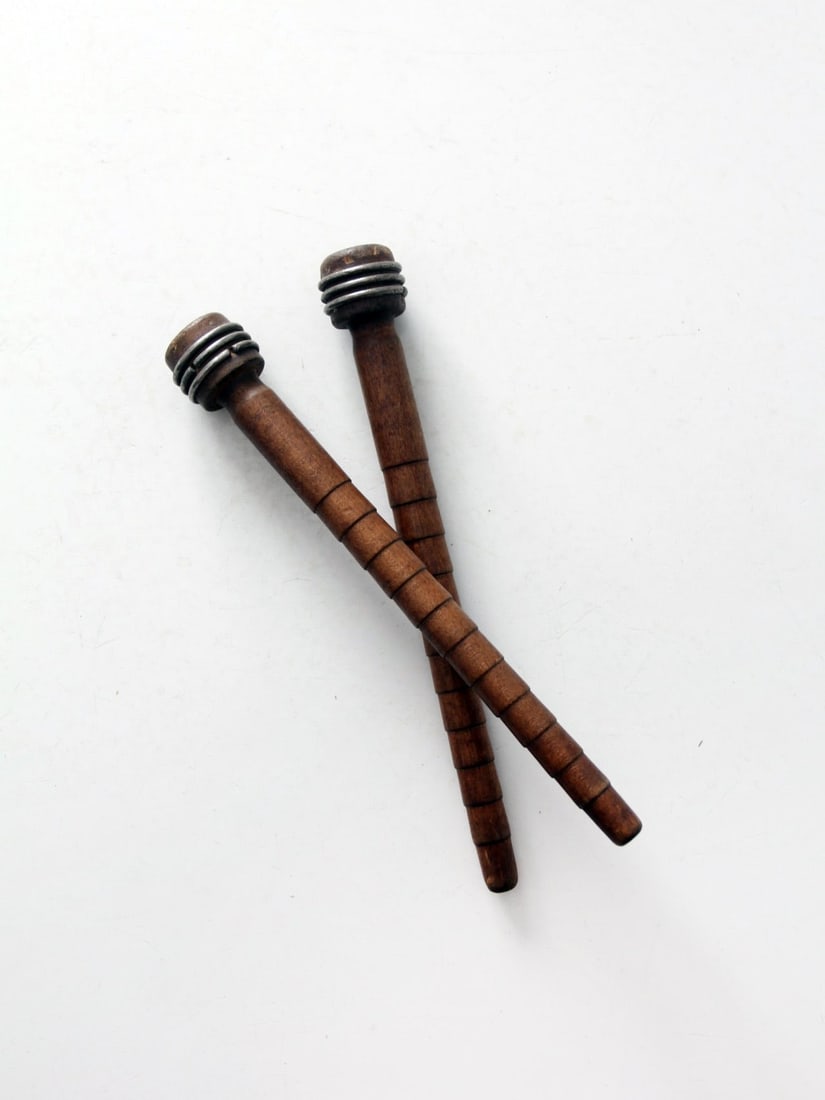 Vintage Pair of Antique Wooden Textile Bobbins 8.75 inches: Vintage Pair of Antique Wooden Textile Bobbins 8.75 inches This pair of antique wooden and metal textile bobbins from the early 20th century beautifully blends rustic charm with industrial character.