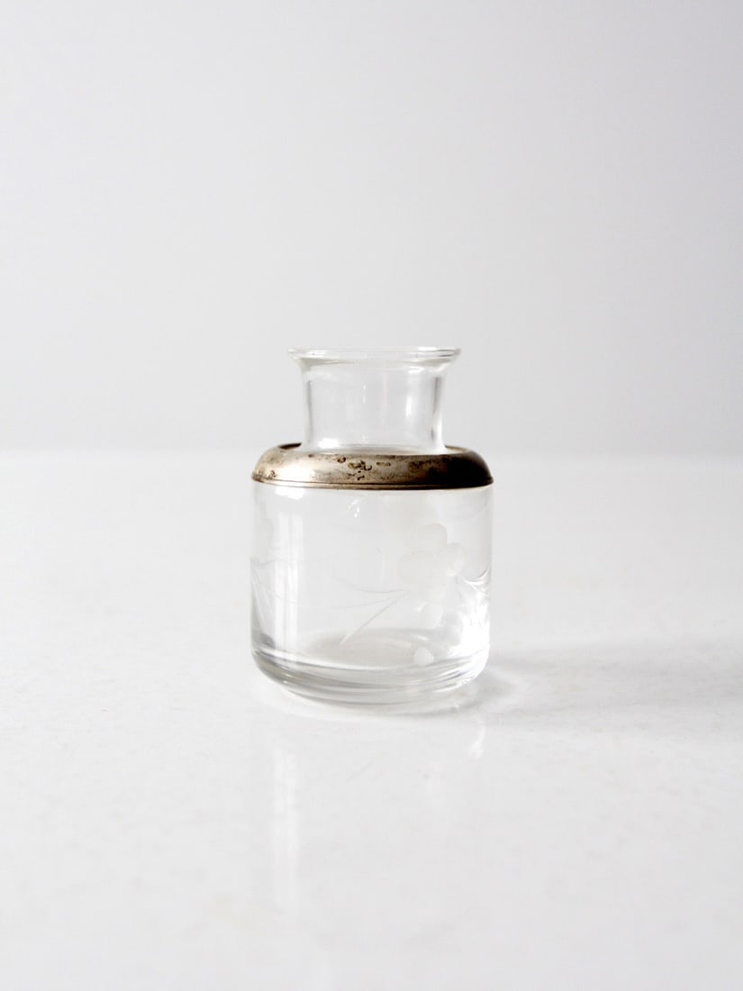 Early 20th Century Floral Etched Glass Vanity Jar with Silver Tone Rim: Early 20th Century Floral Etched Glass Vanity Jar with Silver Tone Rim This early 20th century antique vanity jar features etched glass with delicate frosted floral detailing and a silver-tone rim. Th