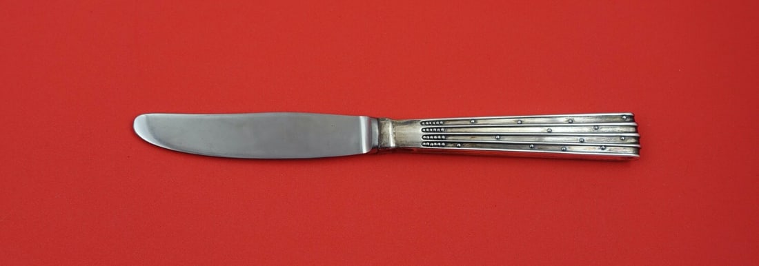 Orla Vagn Mogensen Champagne Sterling Silver Luncheon Knife 7.5 Inches: Orla Vagn Mogensen Champagne Sterling Silver Luncheon Knife 7.5 Inches This exquisite luncheon knife from the "Champagne" pattern, designed by renowned Danish silversmith Orla Vagn Mogensen, features