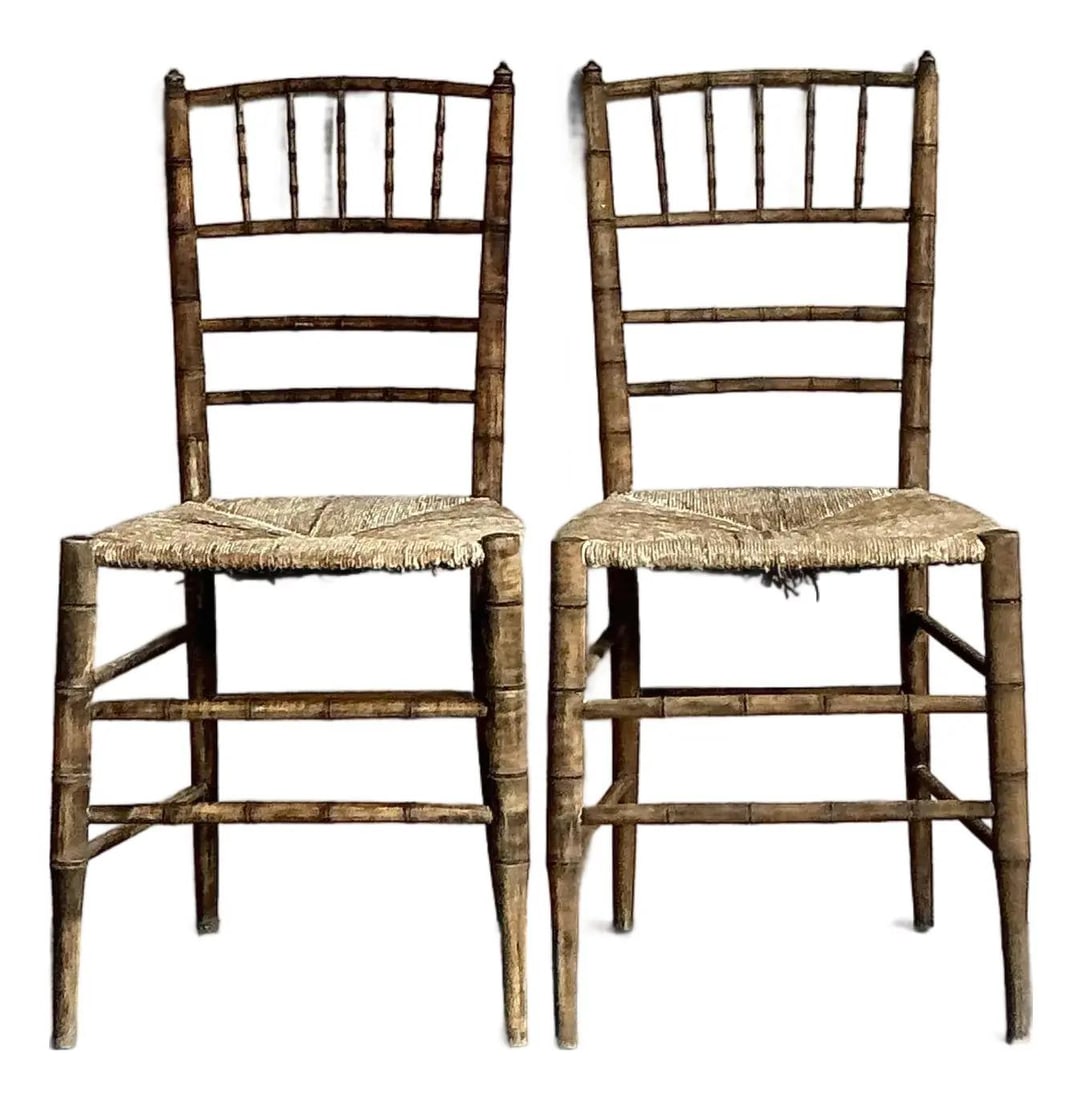 Pair of Vintage French Faux Bamboo Chairs with Rush Seats: Pair of Vintage French Faux Bamboo Chairs with Rush Seats This pair of vintage French Country Chiavari chairs features authentic rush seats and patinated faux bamboo wood frames. The rush weaving demo