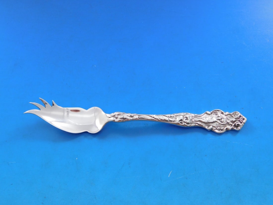 Wallace Irian Sterling Silver 6 Inch Custom Pate Knife: Wallace Irian Sterling Silver 6 Inch Custom Pate Knife This exquisite 6-inch pate knife is crafted from sterling silver and features the elegant Irian pattern by Wallace. It showcases a classic design