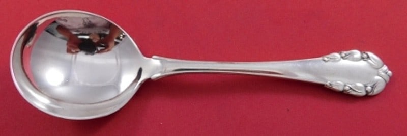 Sterling Silver Bouillon Soup Spoon Lily of the Valley Pattern 5 3/4 Inch: Sterling Silver Bouillon Soup Spoon Lily of the Valley Pattern 5 3/4 Inch This is a pre-owned Georg Jensen bouillon soup spoon in the Lily of the Valley pattern. Crafted from sterling silver, it featu