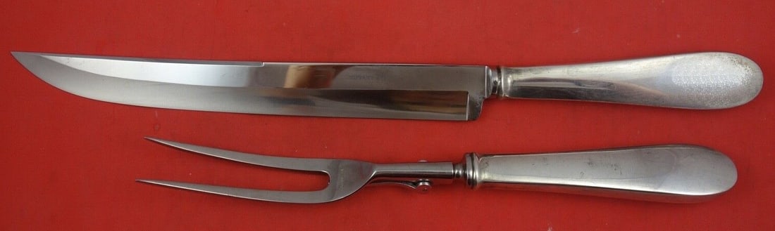 Tiffany & Co King William 2-Piece Sterling Silver Carving Set: Tiffany & Co King William 2-Piece Sterling Silver Carving Set This exquisite King William roast carving set by Tiffany & Co. features a 14-inch knife and a 10 3/4-inch fork, both crafted from high-qua