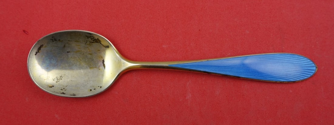 N.M. Thune-Oslow Norwegian Sterling Ice Cream Spoon with Blue Enamel 5.5": N.M. Thune-Oslow Norwegian Sterling Ice Cream Spoon with Blue Enamel 5.5" Delight in serving your favorite frozen treats with this exquisite Norwegian Sterling Ice Cream Spoon, crafted by N.M. Thune-O