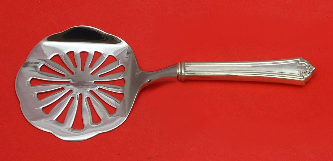 International Sterling Silver Quincy Tomato Server Custom Made 8.5": International Sterling Silver Quincy Tomato Server Custom Made 8.5" This exquisite tomato server features a hollow handle crafted from sterling silver, combined with a durable stainless implement, ens