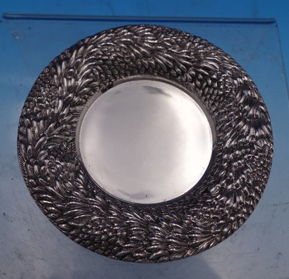 Chrysanthemum Sterling Silver Butter Pat 3 3/4 Diameter: Chrysanthemum Sterling Silver Butter Pat 3 3/4 Diameter This exquisite butter pat features the elegant Chrysanthemum pattern, crafted from high-quality sterling silver (.925). Measuring 1/8" tall and