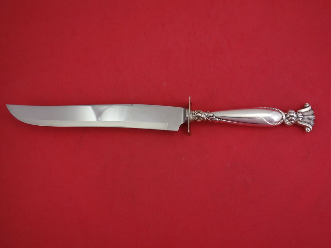 Wallace Romance of the Sea Sterling Silver Roast Carving Knife: Wallace Romance of the Sea Sterling Silver Roast Carving Knife Introducing the exquisite "Romance of the Sea" roast carving knife by Wallace, a stunning piece crafted in sterling silver. This knife fe