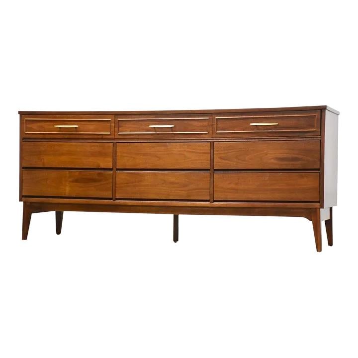 Dixie Mid Century Modern Walnut Dresser with 9 Drawers: Dixie Mid Century Modern Walnut Dresser with 9 Drawers This stunning mid-century modern dresser by Dixie Furniture features a rich walnut finish and offers ample storage with its nine spacious drawers