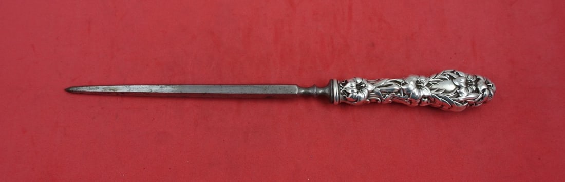 Whiting Lily Sterling Silver Steak Carving Hone 9 5/8": Whiting Lily Sterling Silver Steak Carving Hone 9 5/8" This exquisite steak carving hone features a hollow handle crafted from sterling silver in the elegant Lily pattern by Whiting. Measuring 9 5/8 i