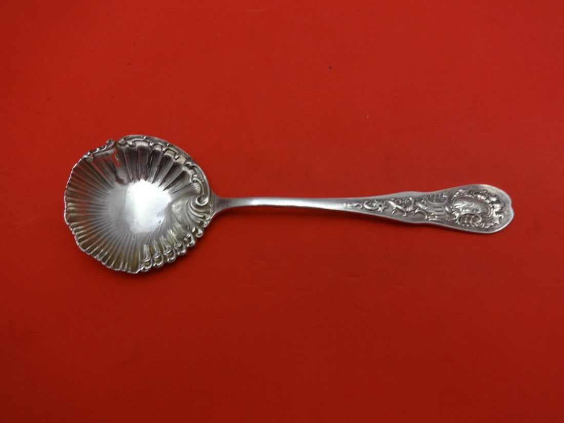 Durgin Pompadour Sterling Silver Nut Spoon 5.5 inches Monogrammed: Durgin Pompadour Sterling Silver Nut Spoon 5.5 inches Monogrammed This exquisite 5 1/2" nut spoon is crafted from high-quality sterling silver and features the elegant Pompadour pattern by Durgin. Eac