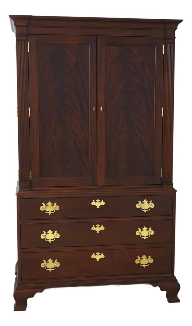 Colonial Williamsburg Mahogany Armoire with Adjustable Shelves and Swivel TV Stand: Colonial Williamsburg Mahogany Armoire with Adjustable Shelves and Swivel TV Stand This entertainment unit armoire embodies Chippendale and traditional styles with its fine carved details and high-qua
