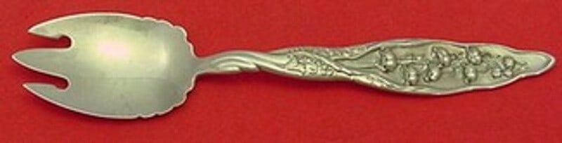 Whiting Lily of the Valley Sterling Silver Ice Cream Fork 5 3/4": Whiting Lily of the Valley Sterling Silver Ice Cream Fork 5 3/4" This exquisite ice cream fork, crafted from sterling silver, showcases the elegant "Lily of the Valley" pattern by Whiting, patented in