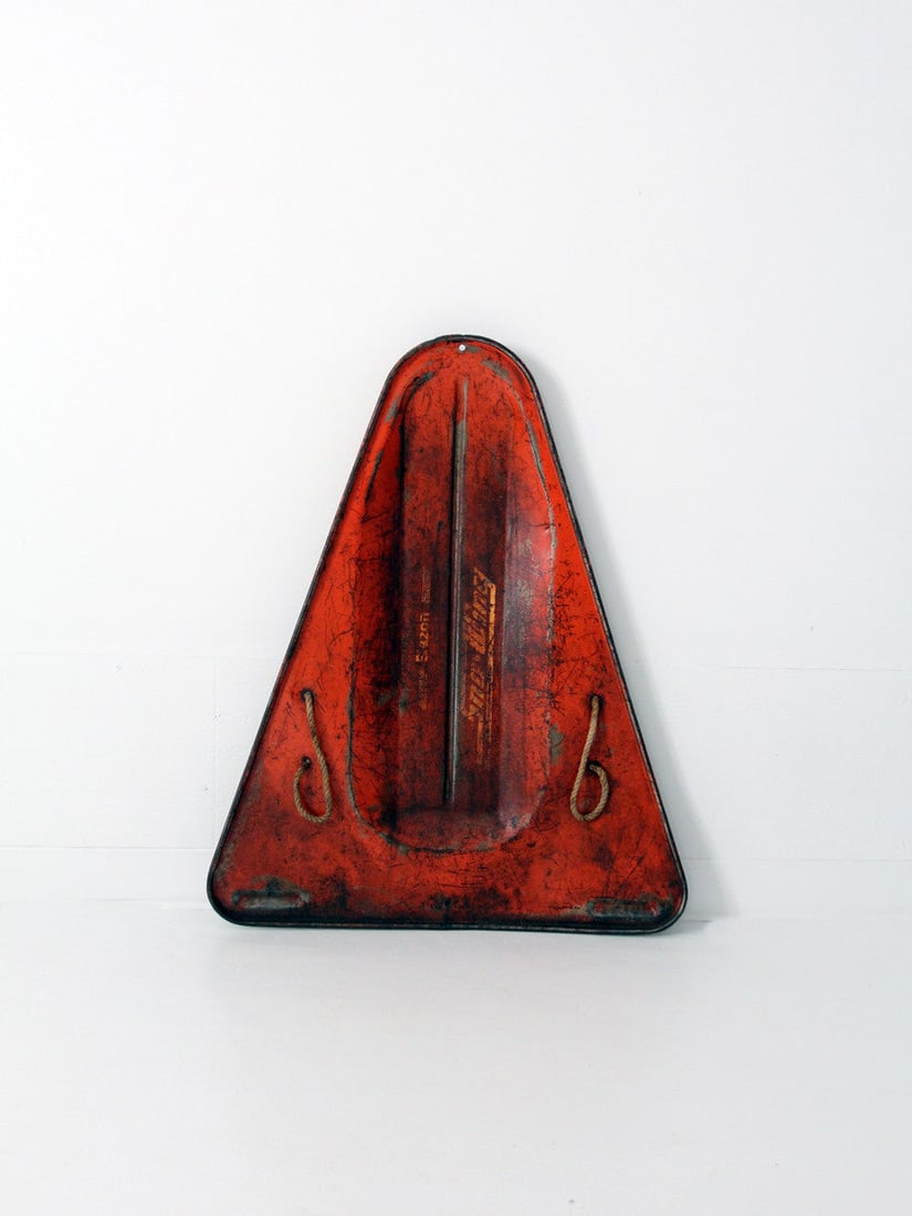 Vintage Blazon Sno-Wing Sled Red Steel Triangle Design 1960s: Vintage Blazon Sno-Wing Sled Red Steel Triangle Design 1960s Embrace the charm of Americana winter decor with this vintage Blazon Sno-Wing sled from the 1960s. Crafted from red pressed steel, this sle