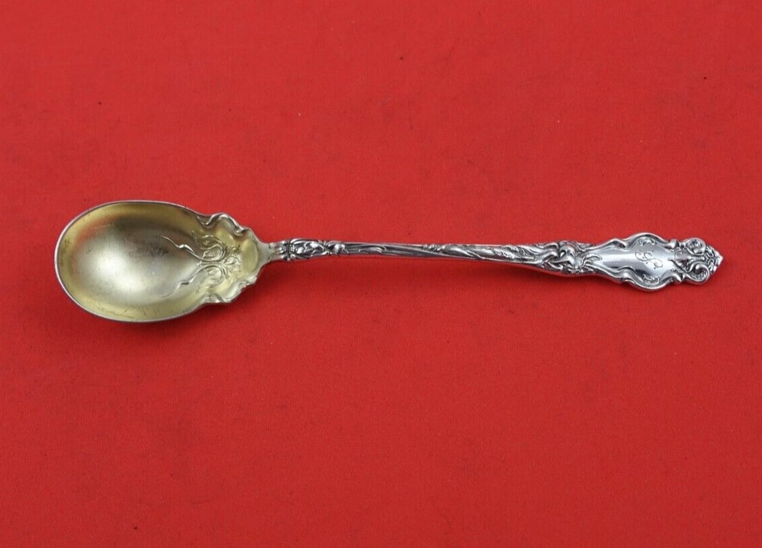 Wallace Eton Sterling Silver Olive Spoon Gold Washed 6 1/4": Wallace Eton Sterling Silver Olive Spoon Gold Washed 6 1/4" This exquisite Eton olive spoon by Wallace is crafted from high-quality sterling silver, featuring a solid gold washed finish. Measuring 6 1