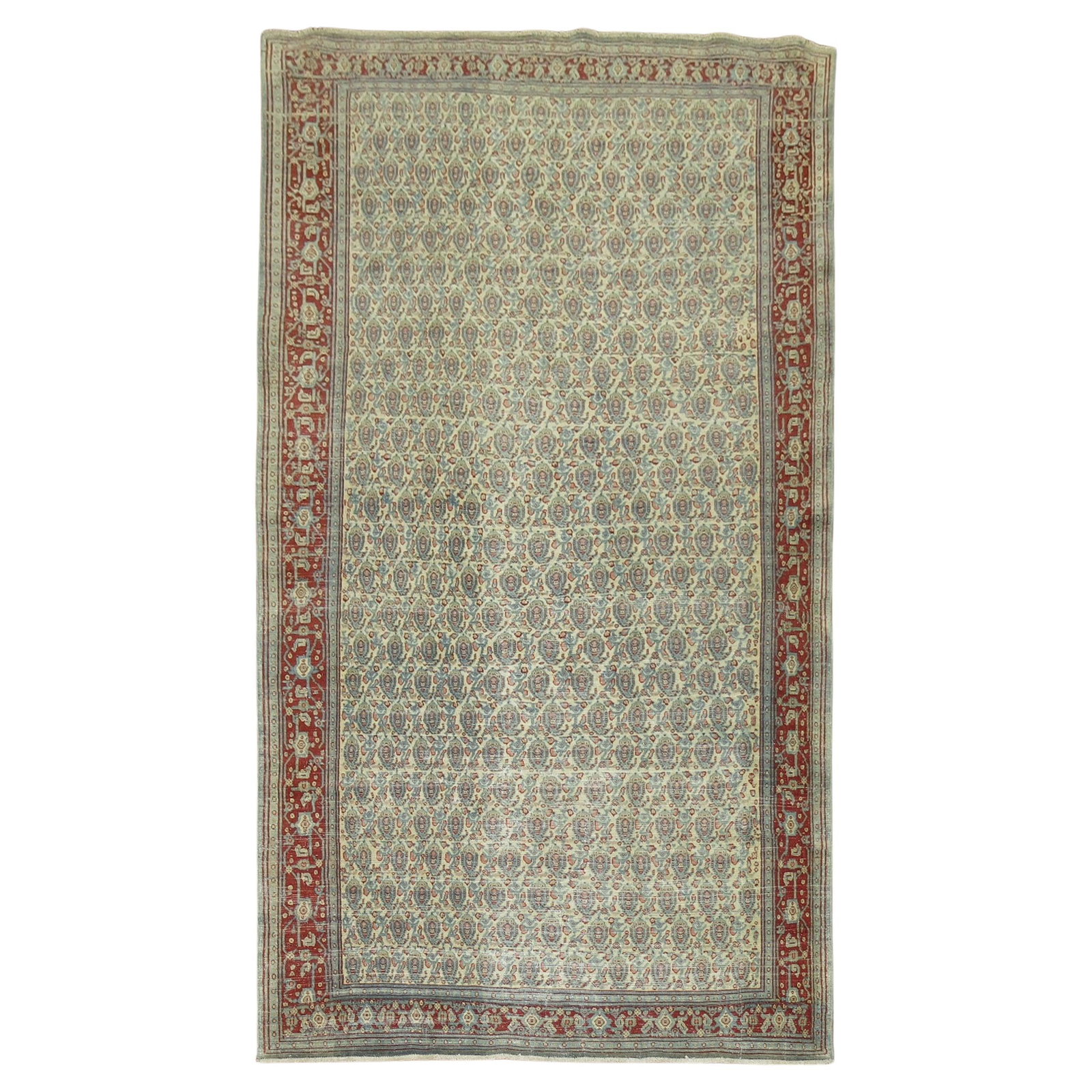 Persian Tabriz Paisley Wool Rug Early 20th Century 57 x 94: Persian Tabriz Paisley Wool Rug Early 20th Century 57 x 94 This exquisite Persian Tabriz rug from the early 20th century showcases a charming repetitive small paisley design set against a light-colore