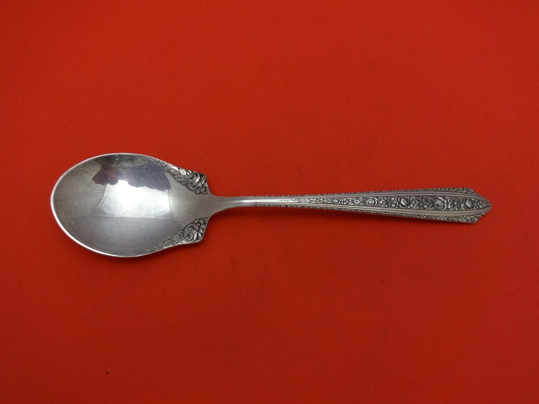 Wallace Normandie Sterling Silver Sugar Spoon 5 1/8 Inches: Wallace Normandie Sterling Silver Sugar Spoon 5 1/8 Inches Sterling silver sugar spoon in the Normandie pattern by Wallace, featuring a fancy bowl design. The spoon measures 5 1/8 inches in length and