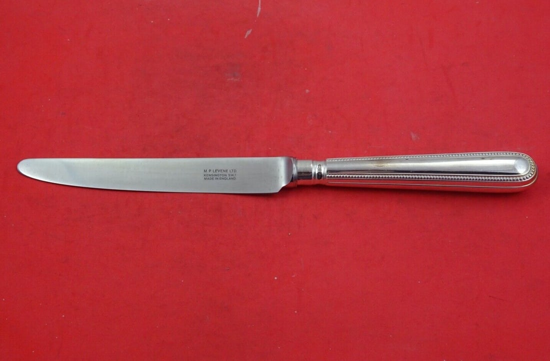 C J Vander Bead Round Sterling Silver Dinner Knife French Blade 10 1/4": C J Vander Bead Round Sterling Silver Dinner Knife French Blade 10 1/4" Elevate your dining experience with this elegant Bead Round dinner knife by C J Vander. Crafted from high-quality sterling silve