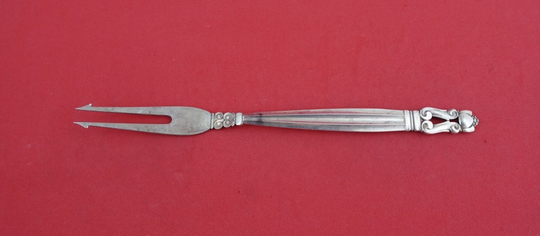 Sterling Silver Acorn Pattern Pickle Fork with Barbs 6 5/8 Inch: Sterling Silver Acorn Pattern Pickle Fork with Barbs 6 5/8 Inch This Acorn pattern pickle fork by Georg Jensen is crafted from sterling silver and features a 2-tine design with barbs. Made in Denmark