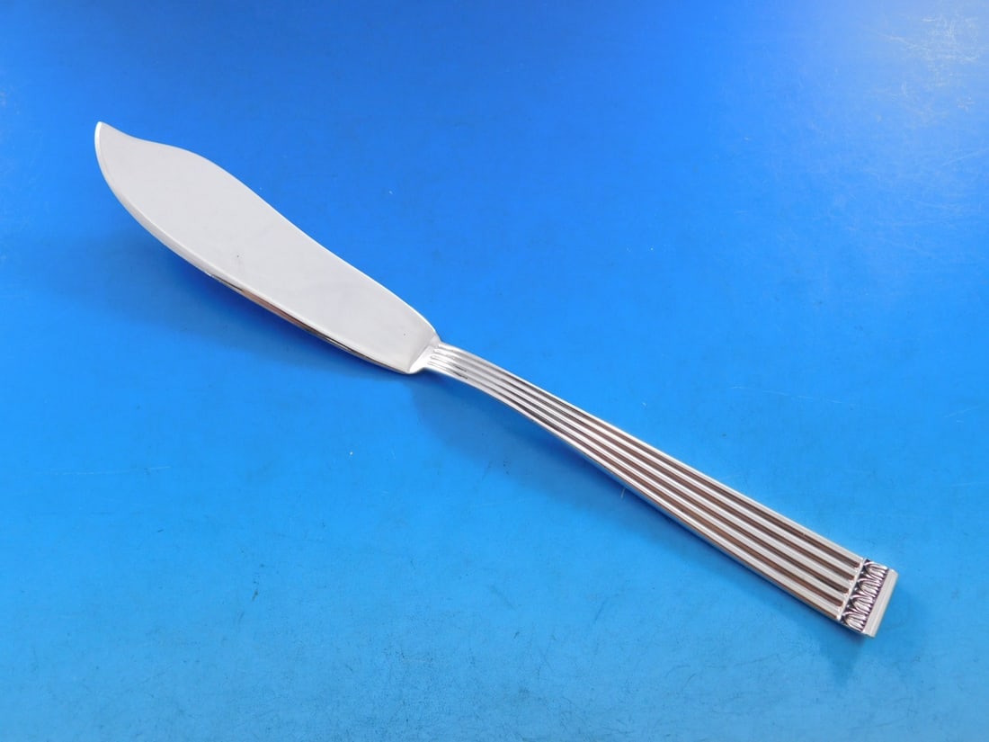 Buccellati Rigato Sterling Silver Fish Knife 8 1/4" Flat Handle: Buccellati Rigato Sterling Silver Fish Knife 8 1/4" Flat Handle Enhance your dining experience with this exquisite Rigato fish knife from Buccellati, crafted in Italy from high-quality sterling silver