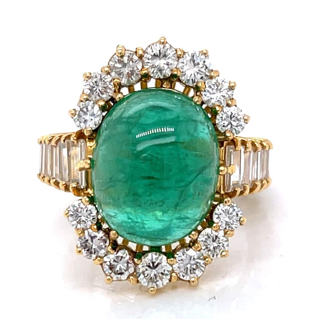 18K Yellow Gold 9.93 Ct SSEF Certified Emerald Diamond Ring: 18K Yellow Gold 9.93 Ct SSEF Certified Emerald Diamond Ring This stunning 18K Yellow Gold ring features a breathtaking 9.93 Ct. SSEF Certified Emerald at its center, surrounded by 31 Baguette Diamonds