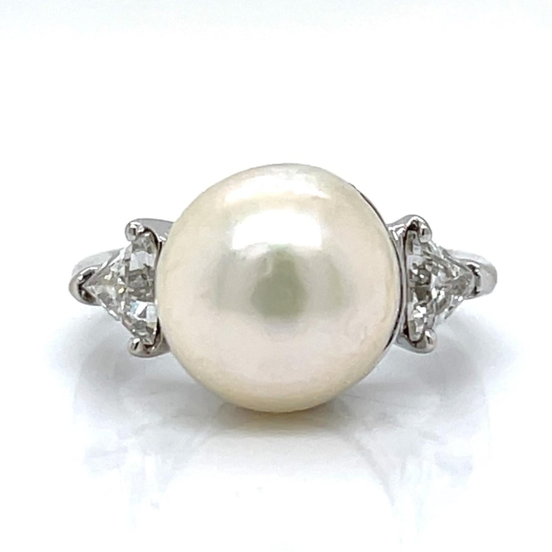 South Sea Pearl and Diamond Ring in 18K White Gold Size 7: South Sea Pearl and Diamond Ring in 18K White Gold Size 7 This elegant ring features a 12.4mm South Sea pearl set in 18K white gold, accented by two diamonds with an approximate combined weight of 1.0