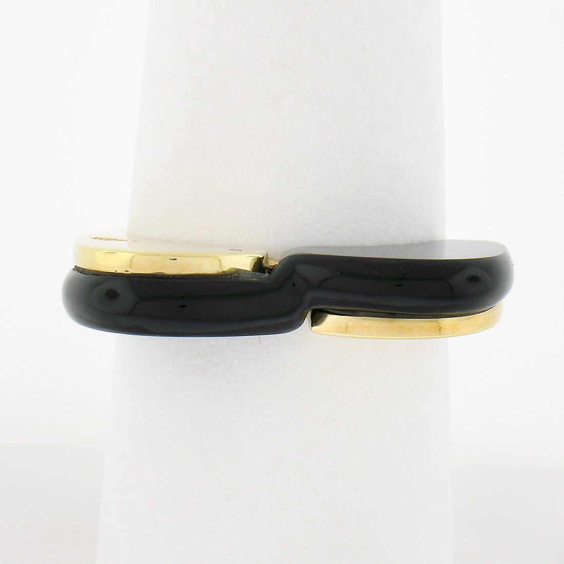 Nina 18K Yellow Gold Heart Shaped Black Onyx Bypass Band Ring: Nina 18K Yellow Gold Heart Shaped Black Onyx Bypass Band Ring This exquisite Nina bypass band ring is crafted from solid 18K yellow gold and features a stunning custom cut black onyx gemstone. The hea