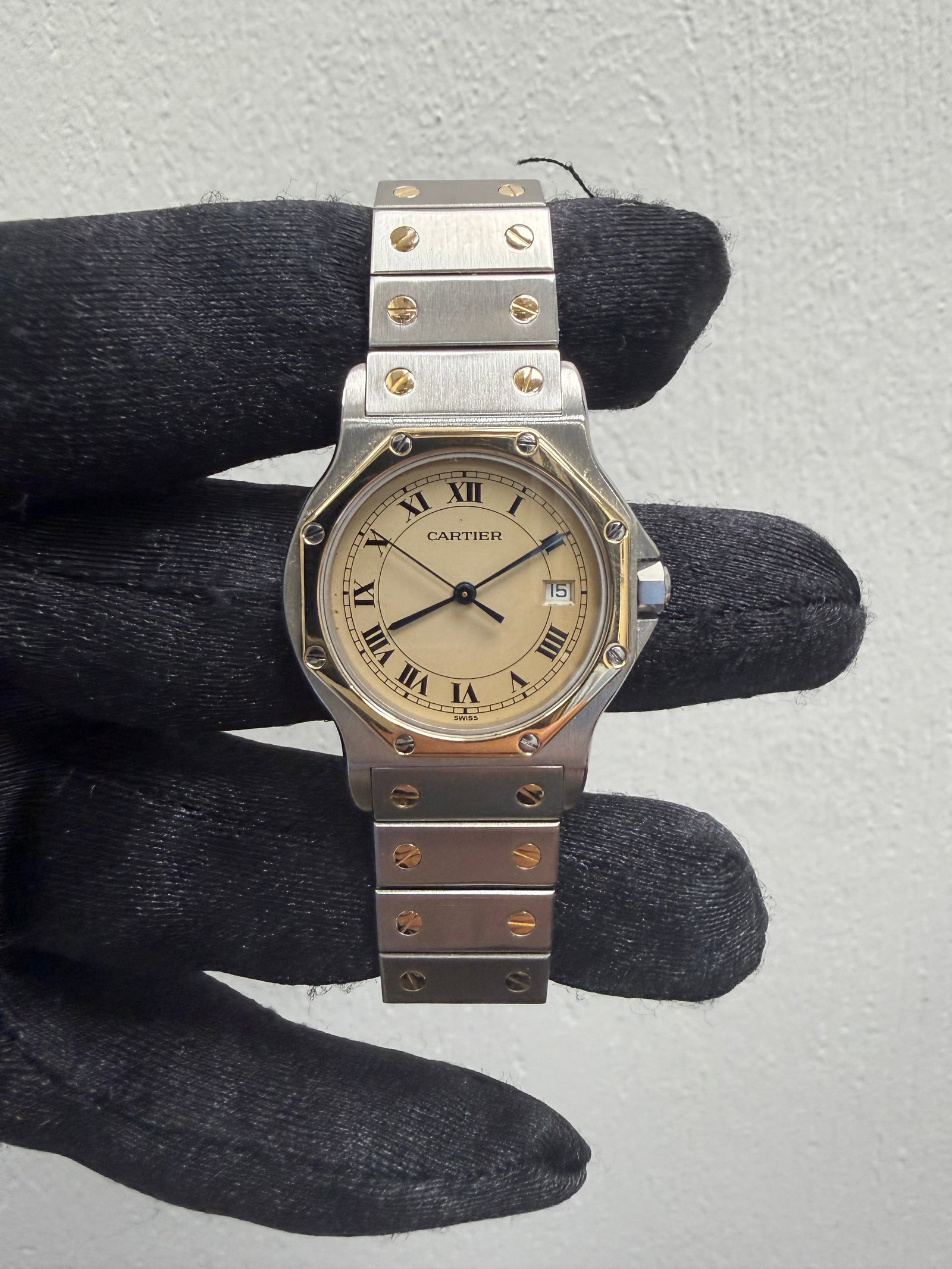 Cartier Santos Ref 187902 Octagonal Watch with Cream Roman Numeral Dial: Cartier Santos Ref 187902 Octagonal Watch with Cream Roman Numeral Dial This is a Cartier Santos Octagon wristwatch featuring a cream Roman numeral dial. The watch is crafted from a combination of yel