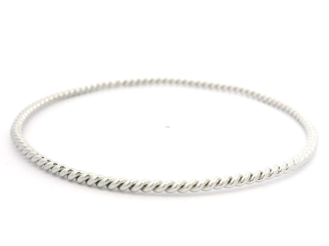 18k White Gold Classic Twisted Cable Stackable Bangle Bracelet: 18k White Gold Classic Twisted Cable Stackable Bangle Bracelet This exquisite 18k White Gold Twisted Cable Bangle Bracelet is designed for elegance and comfort. Crafted from solid 18k white gold, this