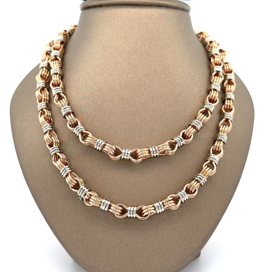 Handcrafted 38 Inch 18k Rose and White Gold Interlocking Link Chain Necklace: Handcrafted 38 Inch 18k Rose and White Gold Interlocking Link Chain Necklace This 38-inch necklace features interlocking handmade wire-wrapped links crafted from 18k rose and white gold. The chain is