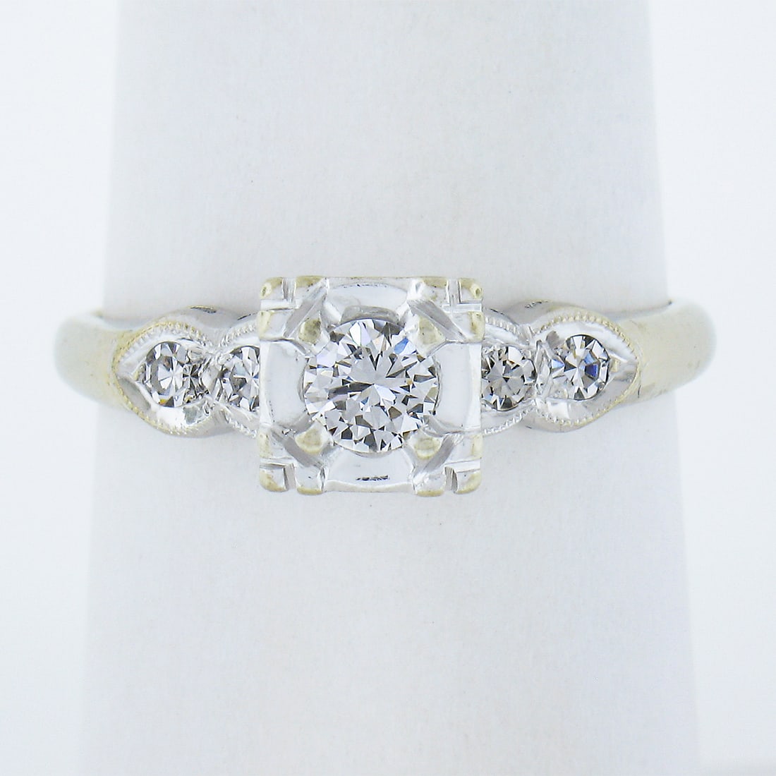 Vintage 14k White Gold 0.35ctw Diamond Solitaire Engagement Ring: Vintage 14k White Gold 0.35ctw Diamond Solitaire Engagement Ring This exquisite vintage engagement ring features a stunning 14k white gold band adorned with a total of 0.35 carats of natural diamonds.