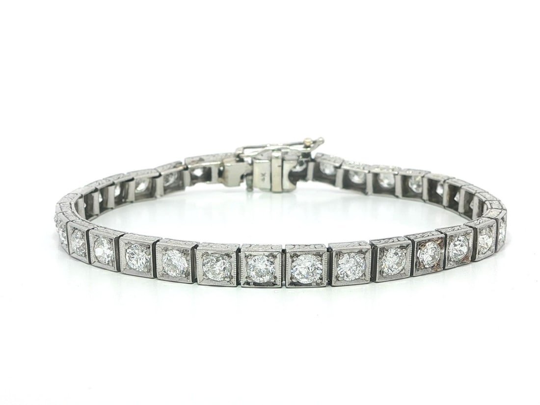 7ctw Old European Cut Diamond Tennis Bracelet Platinum Gold Antique Engraved Design: 7ctw Old European Cut Diamond Tennis Bracelet Platinum Gold Antique Engraved Design This antique tennis line bracelet features approximately 7.0 carats total weight of old European cut natural diamond