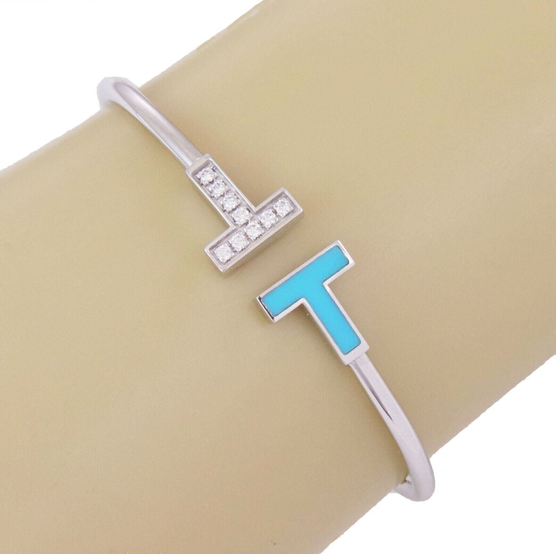 T Wire Diamond Turquoise Cuff Bracelet in 18k White Gold by Tiffany & Co.: T Wire Diamond Turquoise Cuff Bracelet in 18k White Gold by Tiffany & Co. This Tiffany & Co. T Wire diamond and turquoise bangle cuff bracelet is crafted from solid 18k white gold. The bracelet featur