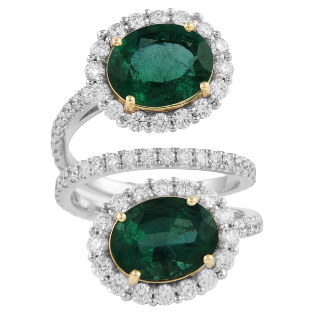 4.79ct Emerald Diamond Bypass Ring 18k White Gold: 4.79ct Emerald Diamond Bypass Ring 18k White Gold This exquisite 4.79ct Emerald & Diamond Bypass Ring is crafted in 18k white gold, featuring a stunning contemporary design. The ring showcases two ova