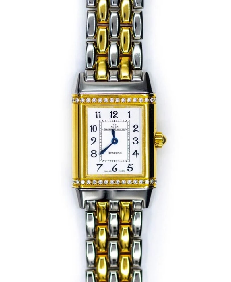 Ladies Reverso Florale Watch Two Tone Factory Diamonds Ref 265.5.08: Ladies Reverso Florale Watch Two Tone Factory Diamonds Ref 265.5.08 This Jaeger LeCoultre Reverso Florale ladies watch features a silver dial with Arabic numerals, a factory diamond-set bezel, and a t