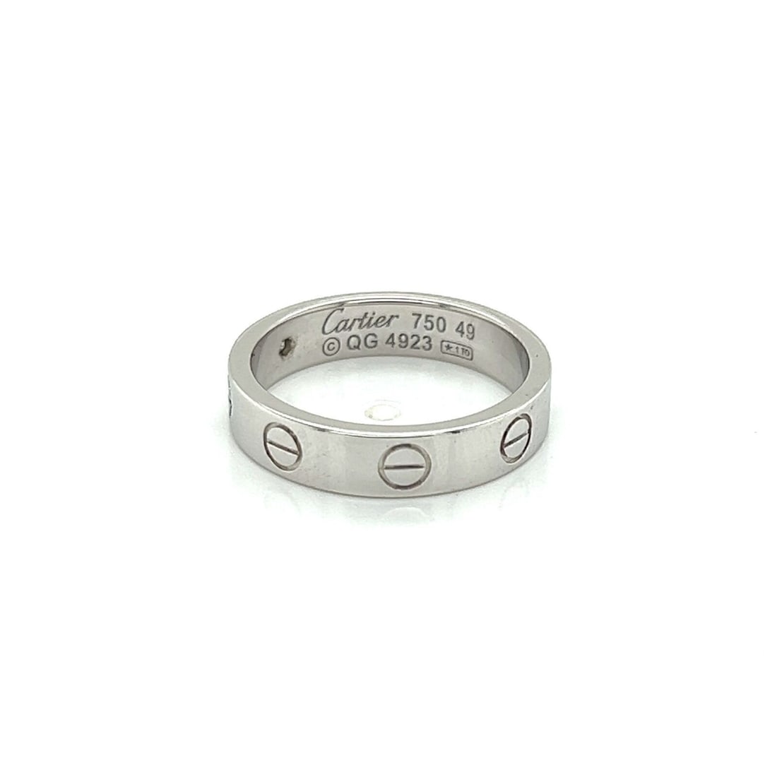 Cartier Mini Love White Gold Diamond Band Ring with Certificate Size 4.5: Cartier Mini Love White Gold Diamond Band Ring with Certificate Size 4.5 This Cartier Mini Love band ring features a single diamond set in 18k white gold. The ring is a size 4.5 (US) and is signed by