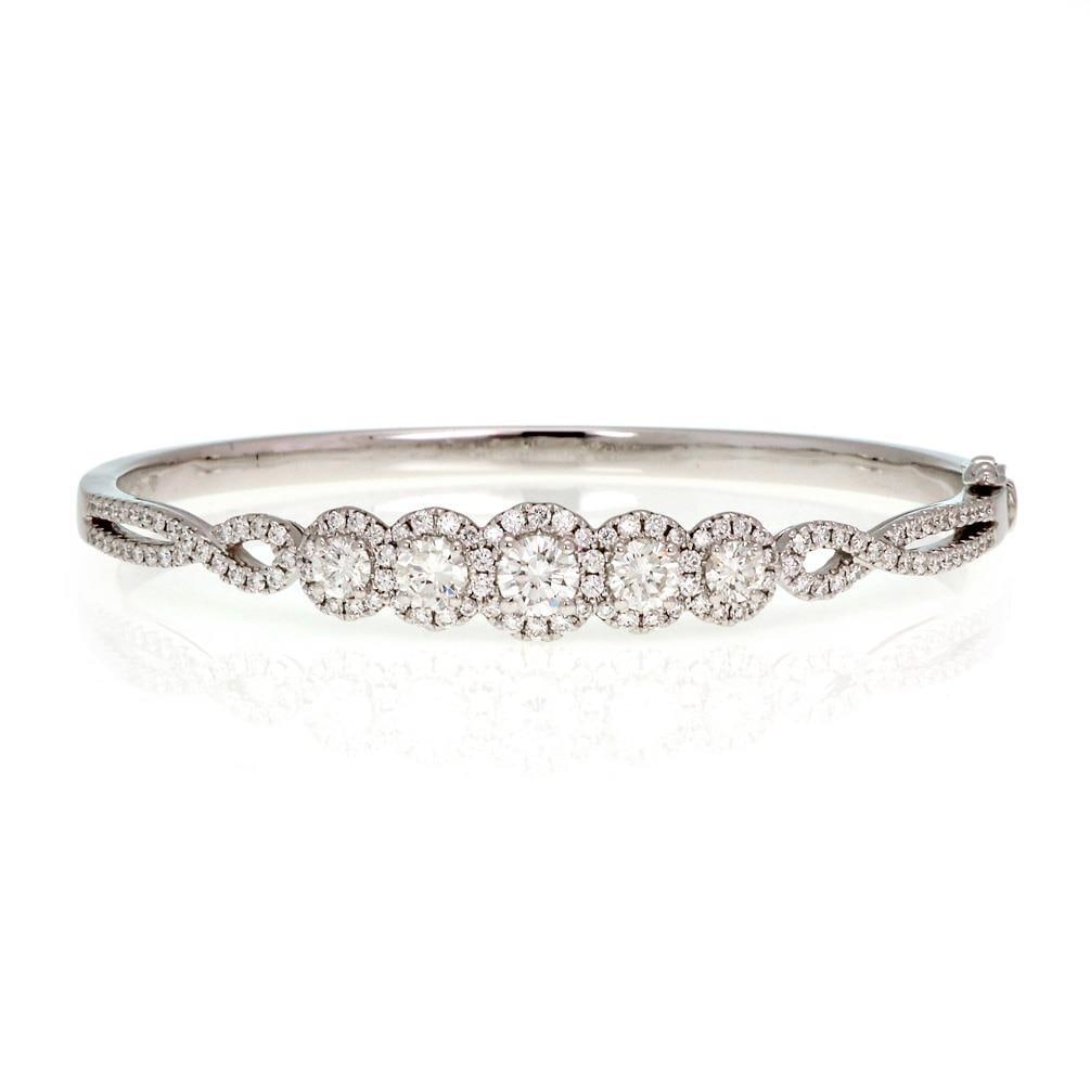 Stunning 2.30ct Diamond 18k White Gold Bangle Bracelet RT 750: Stunning 2.30ct Diamond 18k White Gold Bangle Bracelet RT 750 This exquisite bangle bracelet features a stunning design crafted from 18k white gold with a high polished finish. The front half is adorn