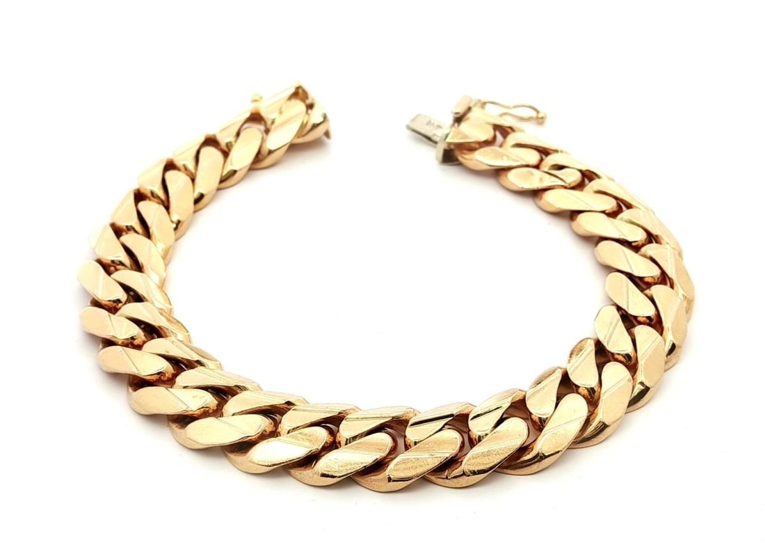 Vintage 14k Yellow Gold Cuban Curb Link Bracelet 10.2mm Width: Vintage 14k Yellow Gold Cuban Curb Link Bracelet 10.2mm Width This vintage Cuban curb link bracelet is crafted from solid 14k yellow gold, showcasing a width of 10.2mm and a thickness of approximately