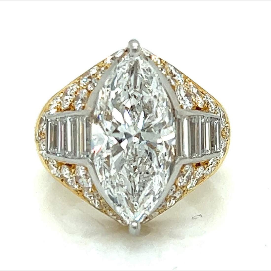 18K Yellow Gold EGL Certified 3.57 Ct Marquise Diamond Ring: 18K Yellow Gold EGL Certified 3.57 Ct Marquise Diamond Ring This exquisite 18K Yellow Gold diamond ring features a stunning center stone: an EGL Certified 3.57 Ct. Marquise Diamond. The diamond boasts